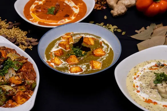 Shared family-style dishes at Chez Nous Wpg restaurant in St. Boniface, Winnipeg